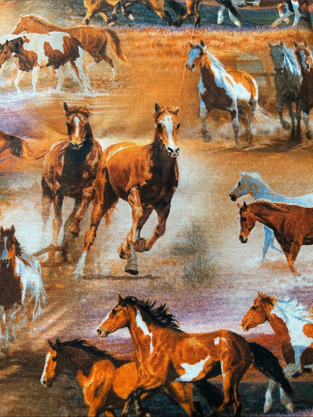 Horse Print Orange Fabric Panel with orange, yellow and blue fabric pieces quilt